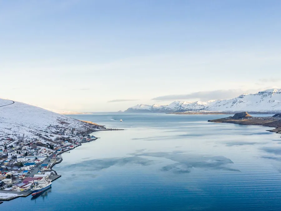 Eskifjörður under snow, seen from the fjord